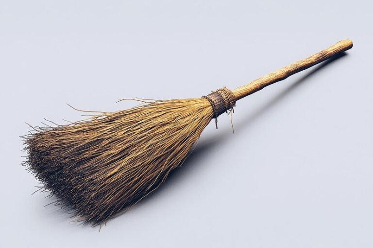 broom-is-standing-upright-against-gray-sky_1277187-57891